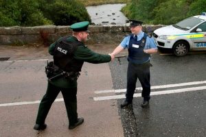 Police and Gardai shaking hands