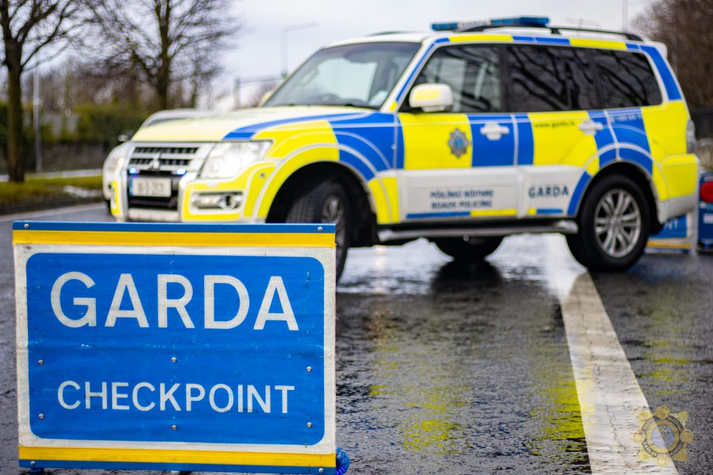 Garda checkpoint with big sign image