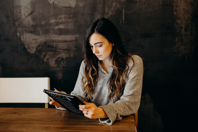 girl holding tablet